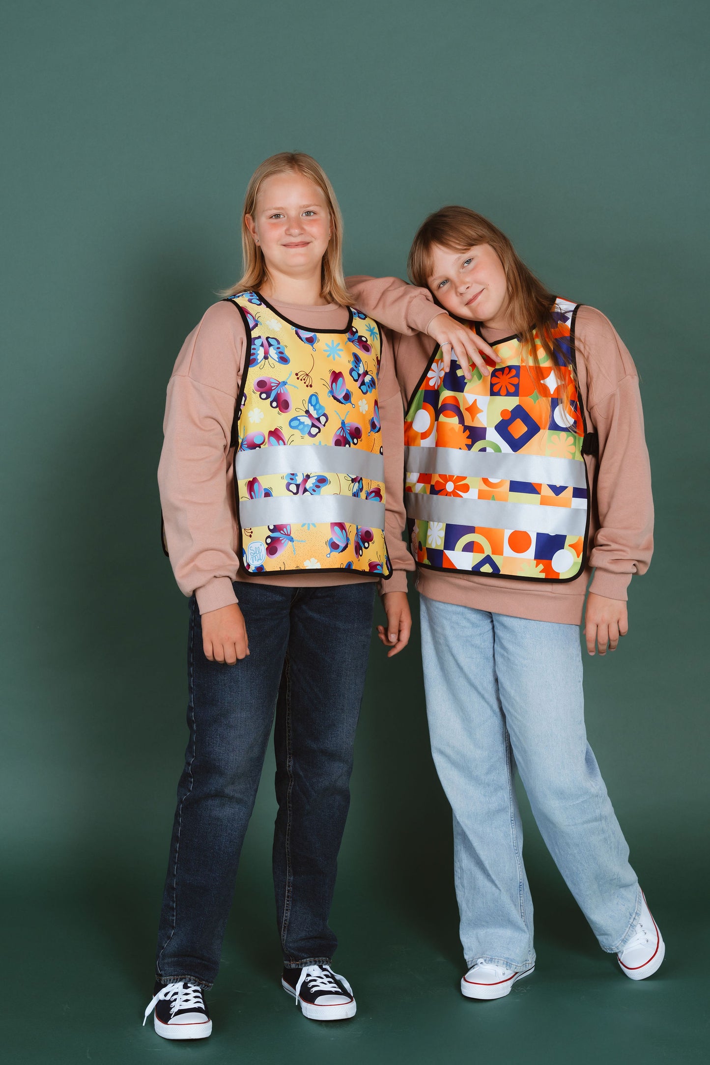 two teenage girls wearing reflective vests